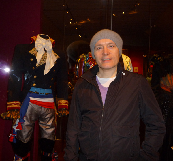 Adam at the V&A performance galleries in front of the display for the Prince Charming costume